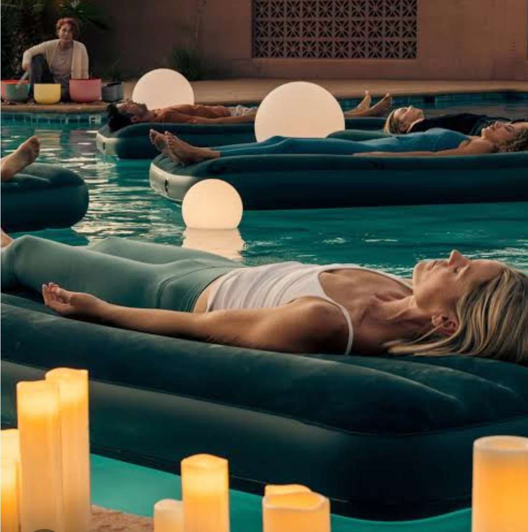 Guests floating on the pool during a Rest Assured Afternoon session